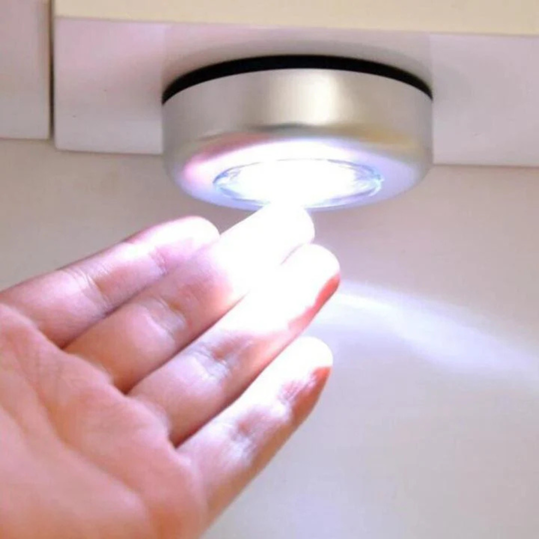 Set of three Avira 3-LED battery-powered tap push lights showing compact design and push button switches for easy activation.