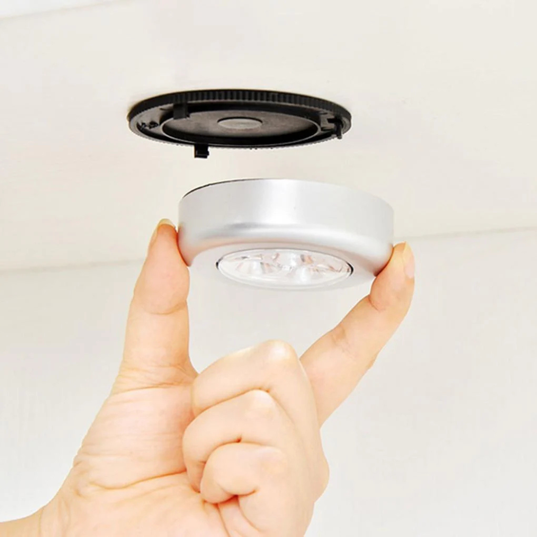 Set of three Avira 3-LED battery-powered tap push lights with black switches, ideal for dark spaces or under cabinets.